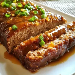 - 1 1/2 lbs ground beef (or a mix of beef and pork) - 1 cup breadcrumbs - 1/2 cup milk - 1/4 cup ketchup The main ingredients make this meatloaf rich and tasty. The beef or pork gives it a juicy bite. Breadcrumbs add texture and help hold it all together. Milk keeps it moist. Ketchup adds a sweet and tangy flavor. - 1/4 cup onion, finely chopped - 2 cloves garlic, minced - 1 tsp Worcestershire sauce - Salt and pepper to taste - 1 tsp ground ginger Next, we add seasonings. Onion and garlic provide depth and warmth. Worcestershire sauce brings umami flavor. Salt and pepper are key to enhance all the tastes. Ground ginger adds a hint of spice that pairs well with the honey. - Chopped green onions Finally, we use chopped green onions for garnish. They add a pop of color and a fresh crunch. This small touch makes your meatloaf look great and taste even better. {{ingredient_image_1}} Start by preheating your oven to 350°F (175°C). Line a loaf pan with parchment paper. Leave some paper hanging over the sides. This helps you lift the meatloaf out later. Next, grab a large mixing bowl. Combine 1 1/2 lbs of ground beef or a mix of beef and pork. Add 1 cup of breadcrumbs, 1/2 cup of milk, and 1/4 cup of ketchup. Toss in 1/4 cup of finely chopped onion, 2 minced garlic cloves, 1 large egg, and 1 tsp of Worcestershire sauce. Season with salt and pepper. Mix gently until everything is just combined. Be careful not to overmix; this can make your meatloaf tough. Transfer the meat mixture to the loaf pan. Shape it into a loaf, pressing it down gently. Make sure it is packed but not too tight. Now, let’s make the glaze. In a small saucepan, combine 1/2 cup of honey, 1/4 cup of low-sodium soy sauce, 1 tbsp of apple cider vinegar, and 1 tsp of ground ginger. Stir these ingredients together over medium heat. Bring the mixture to a simmer. Allow it to cook for about 3–4 minutes. This will thicken the glaze just right. With the meatloaf prepped, it’s time to bake. Brush half of the honey garlic glaze over the top of the meatloaf. Place the pan in the preheated oven. Bake for 45–55 minutes. Check the internal temperature; it should reach 160°F (71°C). About 10 minutes before it’s done, remove the meatloaf from the oven. Baste it with the remaining honey garlic glaze. This adds more flavor and a nice shine. Once cooked, let the meatloaf rest for about 10 minutes. Use the parchment paper to lift it out of the pan. This helps keep it moist. Finally, slice the meatloaf and garnish with chopped green onions before serving. To get the best meatloaf texture, avoid overmixing. When you mix too much, the meatloaf can become tough. Simply combine the ingredients until they just hold together. For moisture, add milk to your mix. This helps keep it juicy. Also, let the meatloaf rest after baking. This step allows the juices to settle and makes each slice moist. For great flavor, use simple seasonings. I recommend adding salt, pepper, and Worcestershire sauce. These enhance the meat's natural taste. Adjust the sweetness and tanginess by changing the honey and vinegar amounts. If you like sweeter meatloaf, add more honey. For more tang, try adding a touch more apple cider vinegar. This balance creates a rich, savory flavor. When serving, slice the meatloaf with a sharp knife. This helps keep clean edges. Arrange the slices on a platter for a nice look. You can also garnish with chopped green onions for color. Pair it with sides like mashed potatoes or steamed veggies. This adds a lovely touch and makes your meal complete. Pro Tips Use Fresh Ingredients: Always opt for fresh garlic and onions for the best flavor in your meatloaf. Let it Rest: Allow the meatloaf to rest for at least 10 minutes after baking to help retain its juices. Experiment with Meat: Try mixing different types of ground meat, like turkey or chicken, for a leaner option. Customize the Glaze: Feel free to add spices or a splash of hot sauce to the glaze for an extra kick. {{image_2}} You can swap ground beef for turkey or chicken. These meats are leaner. They still work well with the honey garlic glaze. The taste will change, but it remains tasty. If you prefer gluten-free options, use gluten-free breadcrumbs. They will hold the meatloaf together just as well. You can find these in most grocery stores. Feel free to make the glaze your own. Add spices like cayenne for heat or smoked paprika for depth. Fresh herbs like rosemary or thyme can add brightness. You can also substitute honey with maple syrup for a different sweetness. Soy sauce can be switched for tamari for a gluten-free option. If you want a slow cooker option, shape the meatloaf and place it in the cooker. Cook on low for 6-8 hours. This method keeps the meatloaf moist and tender. You can also grill the meatloaf for a smoky flavor. Simply form it into a loaf and cook it on medium heat for about 30-40 minutes. Ensure it reaches 160°F (71°C) inside. Grilling adds a unique twist to this classic dish. After baking, let the meatloaf rest for 10 minutes. This helps it keep moisture. If you slice too soon, the juices will run out. Use a sharp knife for clean cuts. This keeps each slice neat for storage. Store leftovers in the fridge within two hours of cooking. Place the meatloaf in an airtight container. It will stay fresh for up to three days. For longer storage, freeze the meatloaf. Wrap it tightly in plastic wrap, then place it in a freezer bag. It’s best used within three months. To reheat in the microwave, slice it first. Heat each slice on medium power for about one minute. Check and heat more if needed. For the oven, preheat to 350°F (175°C). Place slices on a baking sheet and cover with foil. Heat for 15-20 minutes until warm. This method keeps the texture nice. You should bake the meatloaf for 45 to 55 minutes. Set your oven to 350°F (175°C). The meatloaf is ready when its center reaches 160°F (71°C). Use a meat thermometer for accuracy. This ensures a juicy meatloaf, cooked just right. Yes, you can use other meats. Ground turkey or chicken works well. You can also mix beef and pork for a richer flavor. Each meat gives a different texture. Feel free to experiment and find your favorite combo! Many sides pair nicely with meatloaf. Try mashed potatoes for a classic touch. Steamed broccoli adds a fresh element. You could also serve it with rice or a simple salad. These options balance the sweet glaze and make a complete meal. In this blog post, we explored making a delicious honey garlic glazed meatloaf. We covered key ingredients like ground meat, breadcrumbs, and a tasty glaze. You learned how to mix, bake, and garnish your meatloaf for the best flavor. We also shared tips, variations, and storage info to keep it fresh. Now you can impress your family and friends with this easy recipe. Enjoy cooking and experimenting with flavors that suit your taste!