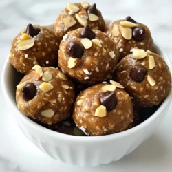 - 1 cup almond butter - 1 cup rolled oats - 1/2 cup honey or maple syrup - 1/4 cup protein powder (vanilla or chocolate flavor) - 1/4 cup mini dark chocolate chips - 1/4 cup chopped almonds - 1 teaspoon vanilla extract - A pinch of sea salt The ingredients for almond butter protein balls come together easily. Almond butter is the base. It gives a creamy texture and nutty taste. Rolled oats add fiber and help bind the mixture. Honey or maple syrup serves as a natural sweetener. You can pick either based on your taste. Protein powder boosts the nutrition. You can choose vanilla or chocolate to match your mood. Mini dark chocolate chips bring a fun twist. They add sweetness without being too much. Chopped almonds give a nice crunch. They also enhance the nutty flavor. Vanilla extract adds depth, while a pinch of sea salt balances the sweetness. Gather these ingredients before starting. This makes the process smooth and quick. You will love how these simple ingredients create such a tasty snack. {{ingredient_image_1}} 1. Mixing the wet ingredients Start by taking a large mixing bowl. Add 1 cup of almond butter, 1/2 cup of honey or maple syrup, and 1 teaspoon of vanilla extract. Stir until the mixture is smooth and well-combined. This step sets a sweet base for your energy bites. 2. Incorporating dry ingredients Next, add 1 cup of rolled oats, 1/4 cup of protein powder (choose vanilla or chocolate), and 1/4 cup of chopped almonds. Don’t forget a pinch of sea salt! Mix everything together until all the dry ingredients spread evenly. This adds texture and boosts nutrition. 3. Adding chocolate chips Lastly, gently fold in 1/4 cup of mini dark chocolate chips. Make sure they are well-distributed. The chocolate adds a nice touch of sweetness and flavor, making these bites enjoyable. 1. Refrigerating the mixture Cover the bowl with plastic wrap. Place it in the fridge for 30 minutes. This helps the mixture firm up, making it easier to roll into balls. 2. Forming energy balls After chilling, scoop out about 1 tablespoon of the mixture. Roll it into a ball, roughly the size of a golf ball. Repeat this step until you use up all the mixture. You’ll have about 12 to 15 energy balls ready to enjoy. 1. Serving suggestions For a nice touch, place the energy bites in a decorative bowl. Sprinkle some chopped almonds on top for an appealing look. You can also wrap individual bites in parchment paper tied with twine for a cute grab-and-go snack. 2. Storage tips Store the energy bites in an airtight container in the refrigerator. They will stay fresh for up to one week. This way, you always have a quick, healthy snack on hand! You can change the sweetness in your protein balls. Use agave syrup or coconut sugar instead of honey or maple syrup. These alternatives add unique flavors. For protein powder, try different types like pea or hemp. Each type adds its own taste and nutrition. To keep it vegan, swap honey for maple syrup. This sweetener works great and keeps the taste sweet. You can also substitute chocolate chips for vegan ones. Many brands offer dairy-free options that taste amazing. Want to make your protein balls even better? Add seeds like chia or flax for crunch and nutrition. Dried fruits like cranberries or apricots bring sweetness and chewiness. For flavor, try adding a dash of cinnamon or a splash of almond extract. These small changes can make a big difference! Pro Tips Chill for Better Texture: Allow the mixture to chill for a full hour instead of 30 minutes to achieve a firmer texture that holds together better. Flavor Variations: Experiment with different nut butters like peanut or cashew for unique flavors, or try adding spices like cinnamon for an extra kick. Protein Boost: For an extra protein boost, consider adding seeds like chia or flaxseed to the mixture, enhancing both nutrition and texture. Serving Suggestions: Pair these energy bites with a piece of fruit or a yogurt dip for a balanced snack that keeps you energized throughout the day. {{image_2}} You can change the taste of almond butter protein balls easily. Here are two fun ideas: - Peanut butter protein balls: Swap almond butter for peanut butter. This will give the bites a rich, nutty flavor. You can use the same amount of peanut butter as almond butter. The texture will stay smooth and creamy. - Coconut almond protein balls: Add shredded coconut to the mix. Use about 1/2 cup of unsweetened shredded coconut. The coconut adds a tropical twist and pairs well with almond butter. You can even top the balls with a sprinkle of coconut for extra crunch. These protein balls can fit into many diets. Here are some smart changes: - Gluten-free options: Use certified gluten-free oats in your recipe. This way, those with gluten sensitivities can enjoy these bites too. Check the label to ensure they are gluten-free. - Low-carb adjustments: Substitute honey or maple syrup with a low-carb sweetener. Erythritol or stevia work well. This change keeps the bites sweet while reducing carbs. You can also cut down on oats if you want fewer carbs in each ball. To keep your almond butter protein balls fresh, use airtight containers. Store them in the fridge to help them last longer. They will stay tasty for up to a week. Make sure the container is sealed tight. This will prevent air and moisture from spoiling the flavor and texture. For the best taste, place them in a cool, dry spot. Avoid direct sunlight and heat. These conditions help maintain their flavor and quality. You can freeze almond butter protein balls for longer storage. To do this, first, roll them into balls. Then, place them on a baking sheet. Make sure they are not touching each other. Freeze them for about two hours. Once frozen, transfer the balls to a freezer-safe container or bag. When you are ready to enjoy them, thaw the balls. You can leave them in the fridge overnight or let them sit at room temperature for about 30 minutes. They will taste just as good after freezing! Almond butter protein balls last for up to one week in the fridge. Store them in an airtight container. The cool temperature keeps them firm and fresh. You can also freeze them for longer storage. If frozen, they can last for about three months. Just make sure to thaw them in the fridge before eating. Yes, you can use peanut butter instead of almond butter. The taste will change, but it will still be tasty. Peanut butter will give a richer flavor. Just make sure to use the same amount. This swap is great for those who prefer the taste of peanuts or have allergies to almonds. Yes, almond butter protein balls are healthy. They mix protein, fiber, and healthy fats. Almond butter provides good fats, while oats add fiber. Honey or maple syrup gives a natural sweetness. The dark chocolate chips add a treat without too much sugar. This snack is perfect for energy and satiety. In this post, we explored the essentials of making almond butter protein balls. You learned the key ingredients and simple steps for preparation, chilling, and rolling. We also discussed tips for customization, variations, and storage techniques. These energy balls are not only tasty but also easy to make. With a few tweaks, you can match them to your diet or preferences. Enjoy making these healthy treats that fuel your day!
